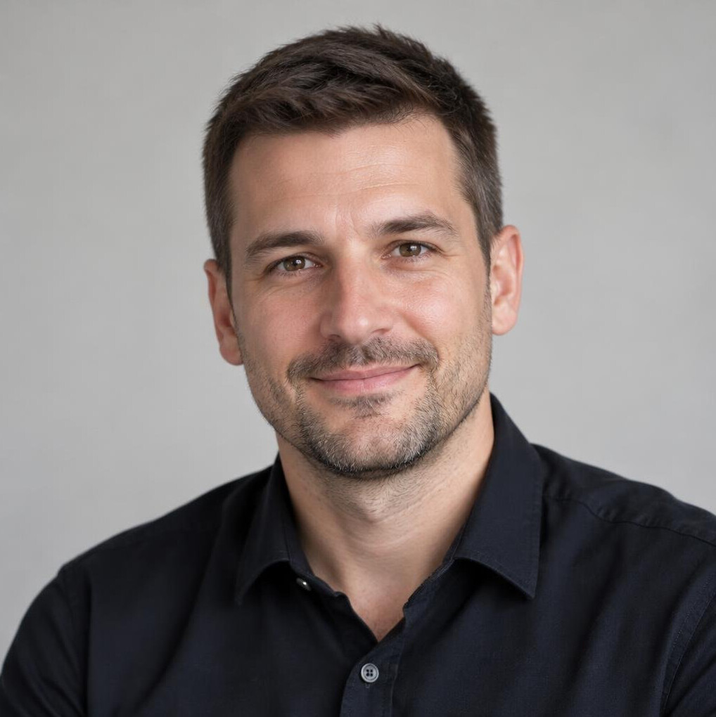 Portrait of a man with short hair and light stubble