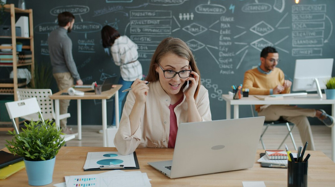 successful businesswoman at desk